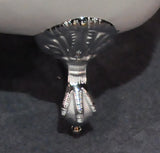 Close-up of chrome claw foot from Still Waters Bath
