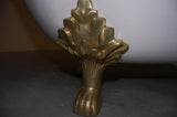Close-up of Polished Brass Lion Paw Foot for Taylor 71-inch Double Slipper Cast Iron Bathtub from Still Waters Bath