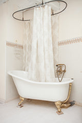 Samantha 61-inch Slipper Cast Iron Bathtub with wall mounted faucet and polished brass feet from Still Waters Bath