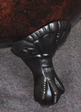 Close-up of oil-rubbed bronze claw foot from Still Waters Bath